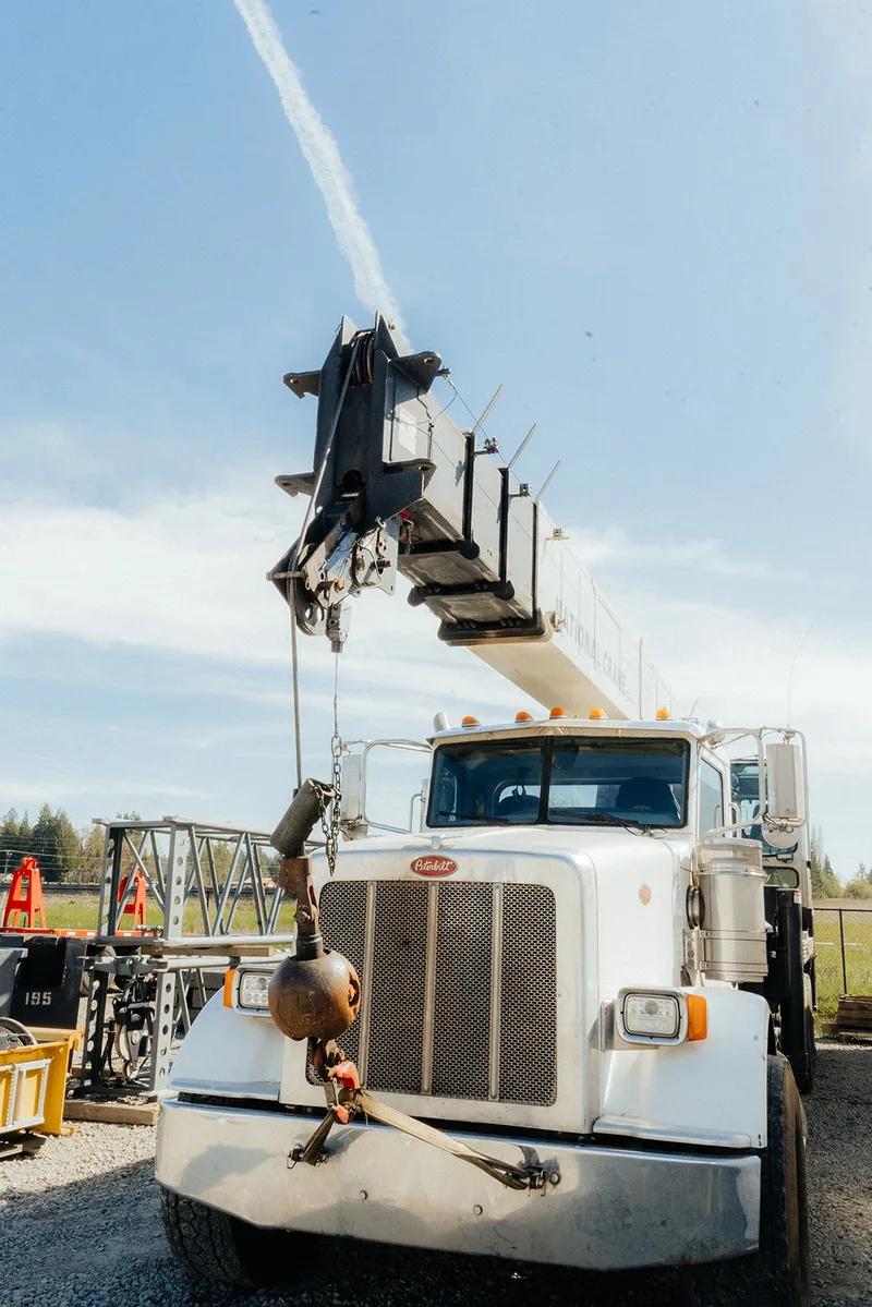 Westmore National Crane boom truck on a Peterbilt with the boom raised, front view